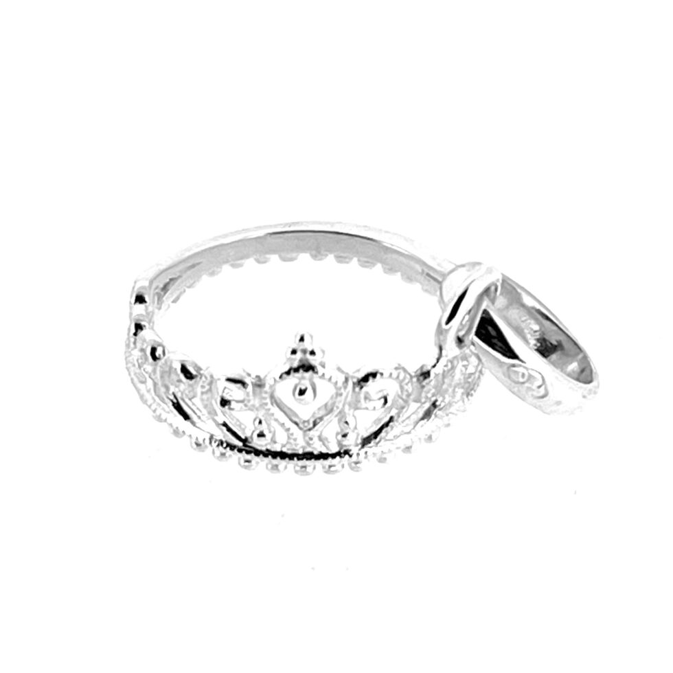 Macro of tiara detail showing curved arches and polished finish.