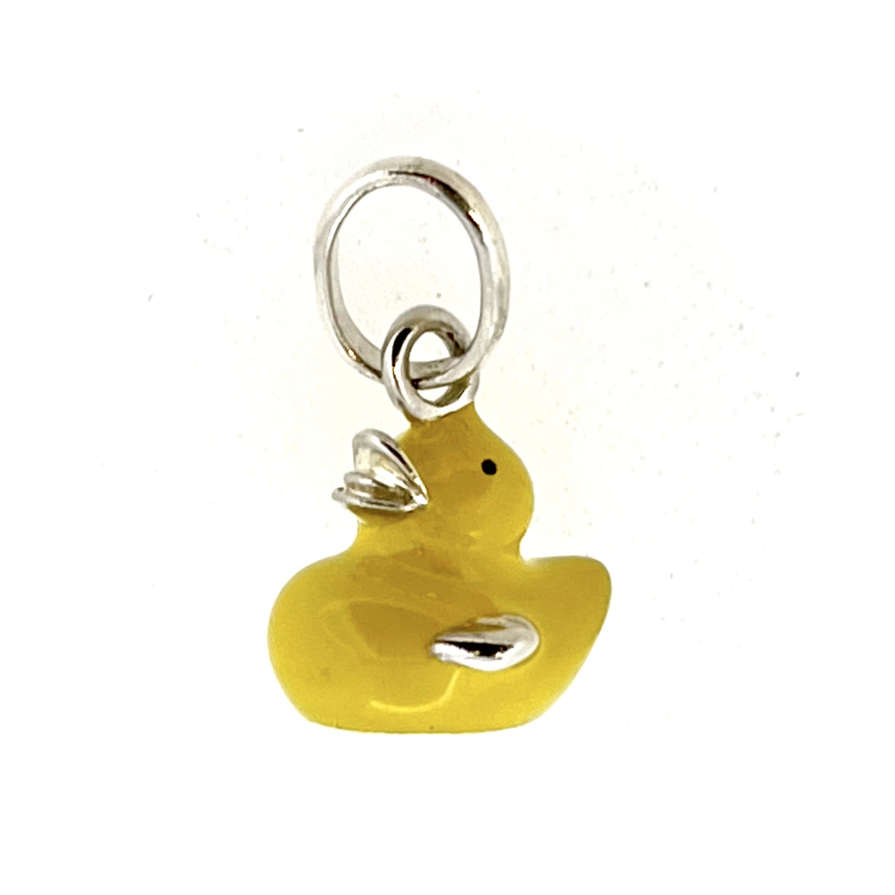 Charm viewed from above highlighting curved form