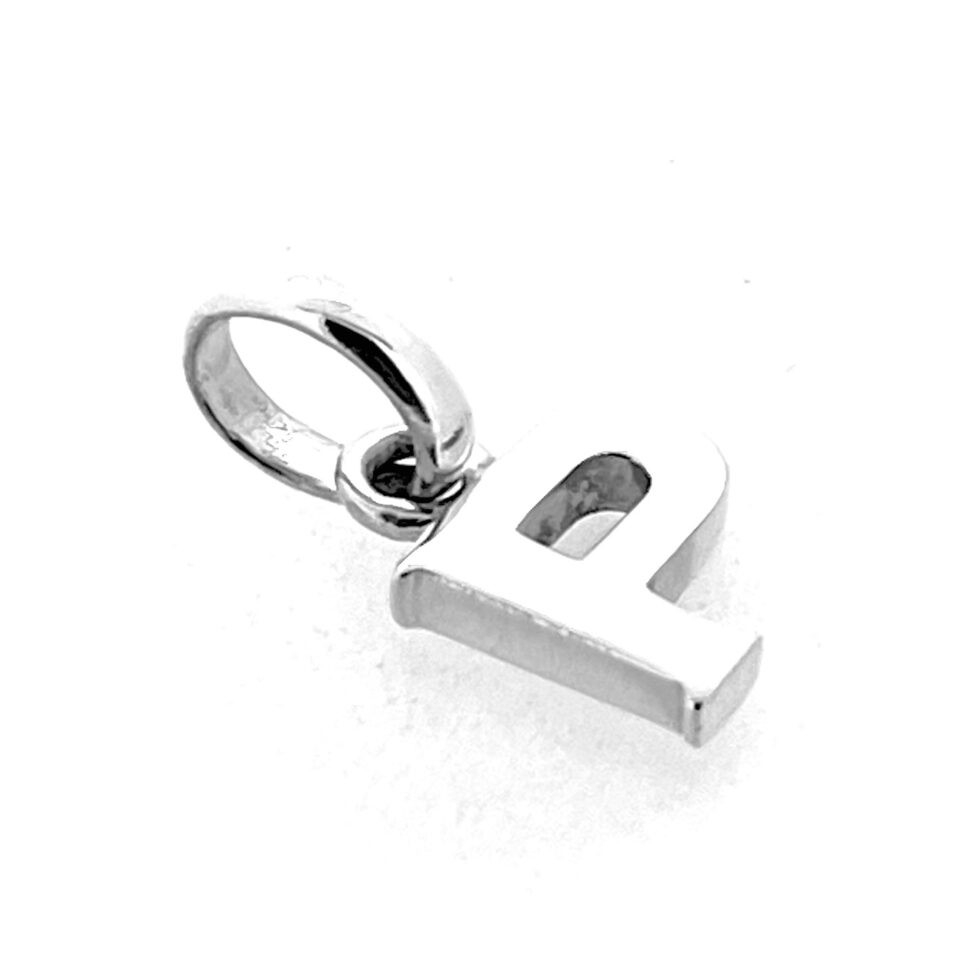 Side angle showing depth and polish of P charm