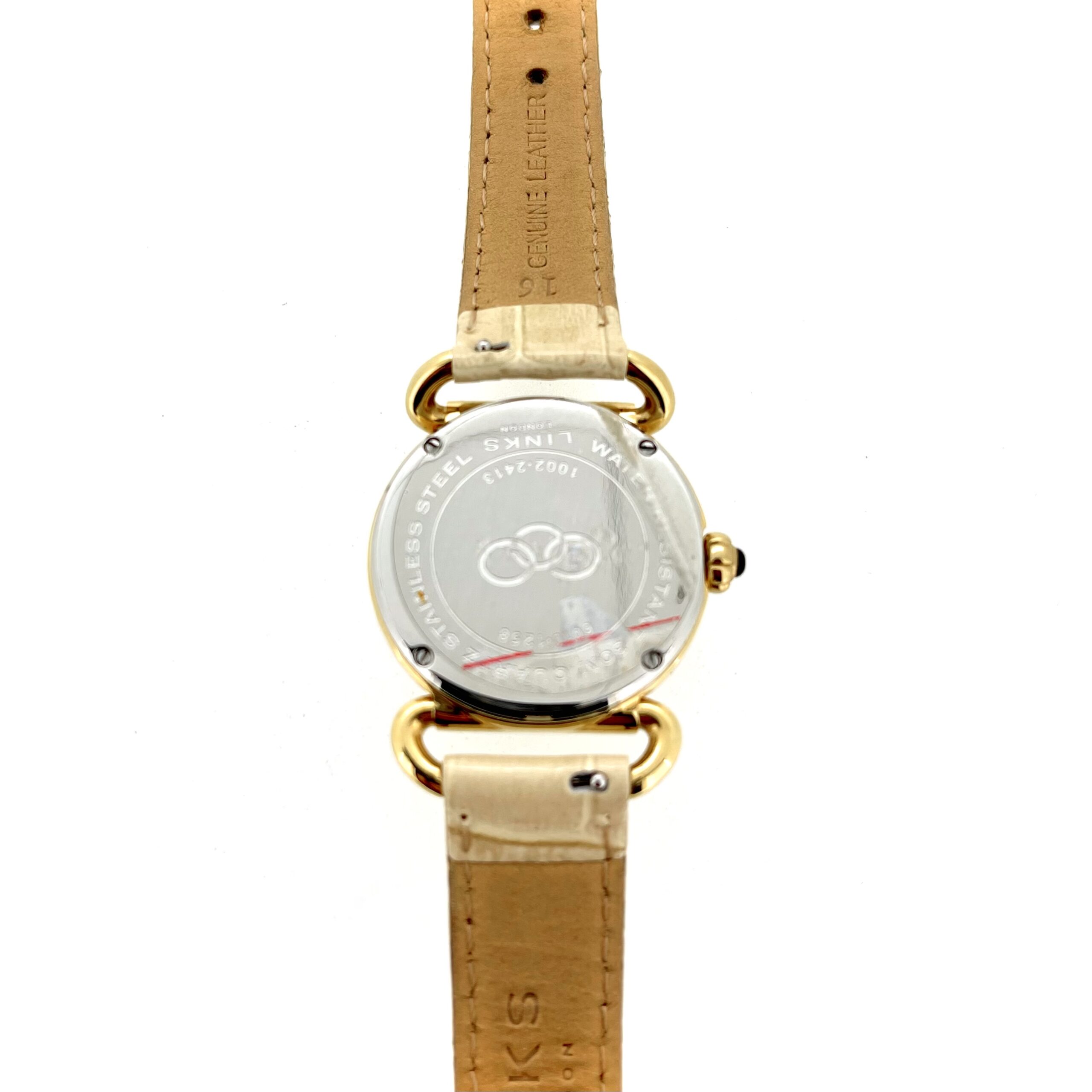 Case-back engraving showing model 6010 1258 and 1002 2413 with three-ring logo.