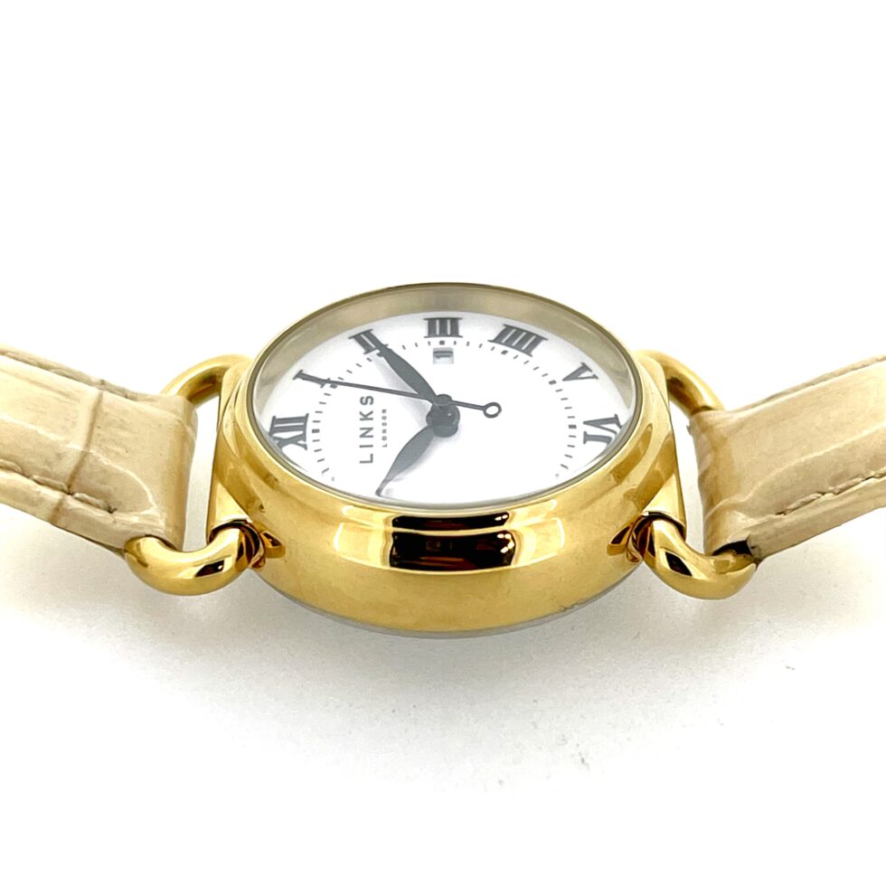 Top-down view showing 31 mm gold-plated case and elegant proportions.