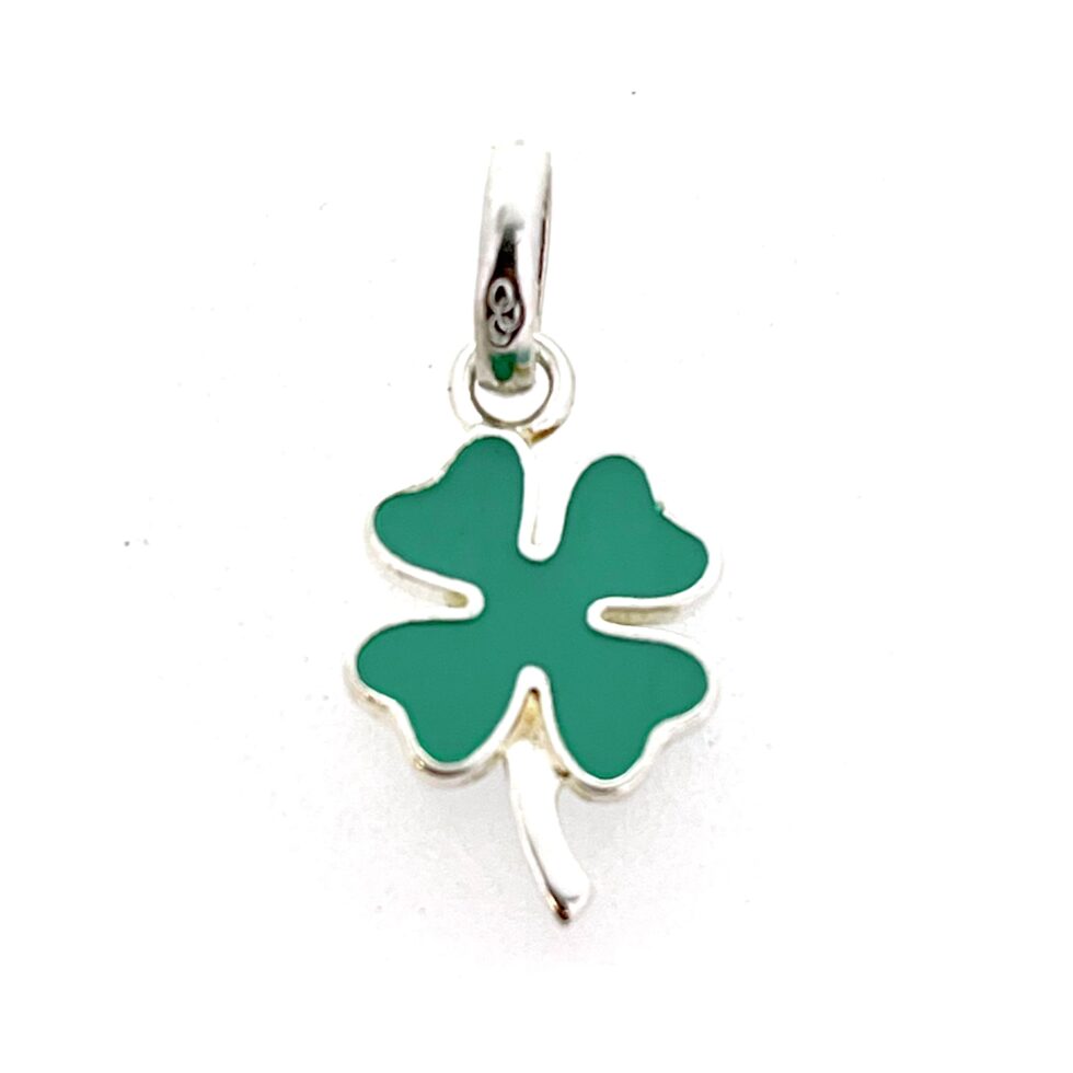 Close-up of opaque green enamel surface on charm