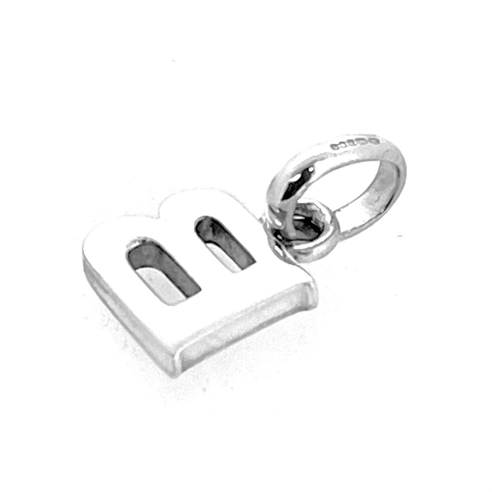 Side profile showing thickness of B charm.