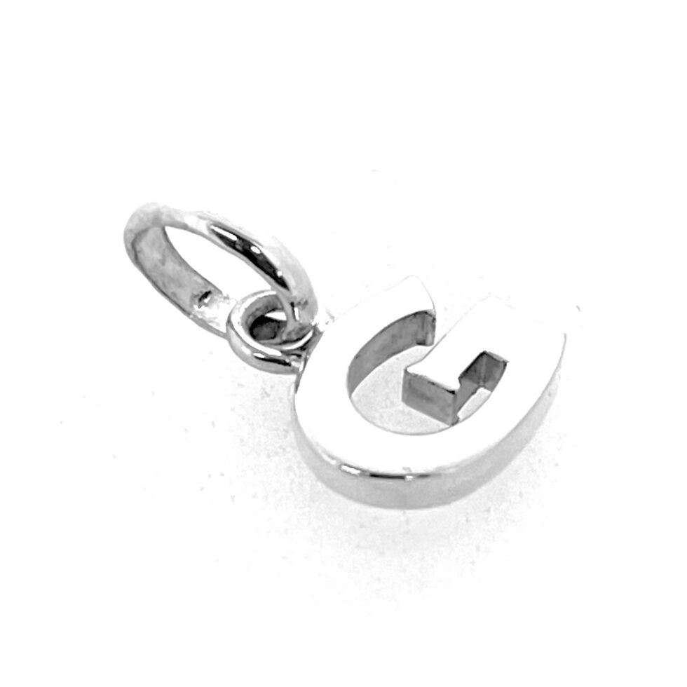 Side angle showing smooth silver finish of Letter G Charm
