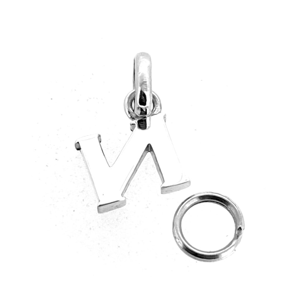 Vintage Links of London alphabet charm plain background