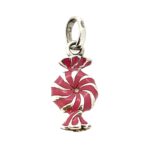 Pink enamel sweet charm photographed on white background