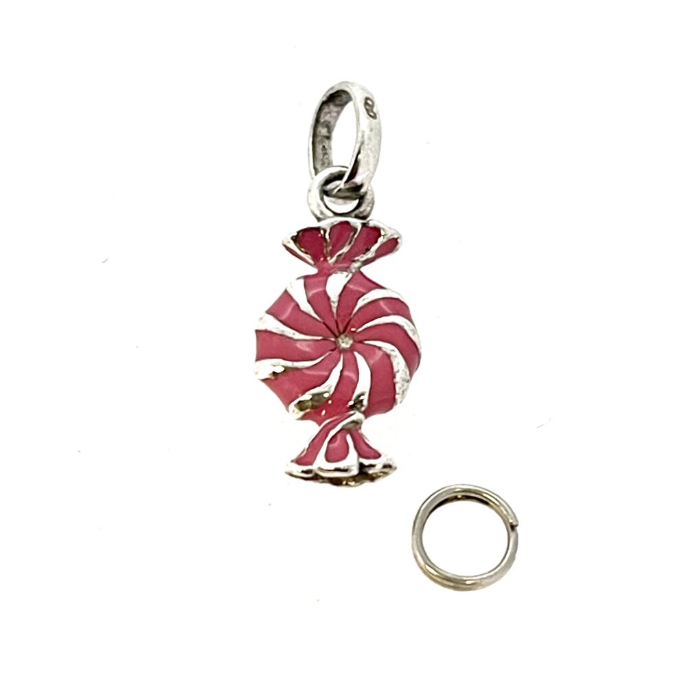 Close-up of Pink Candy Charm showing pink enamel and polished silver spiral