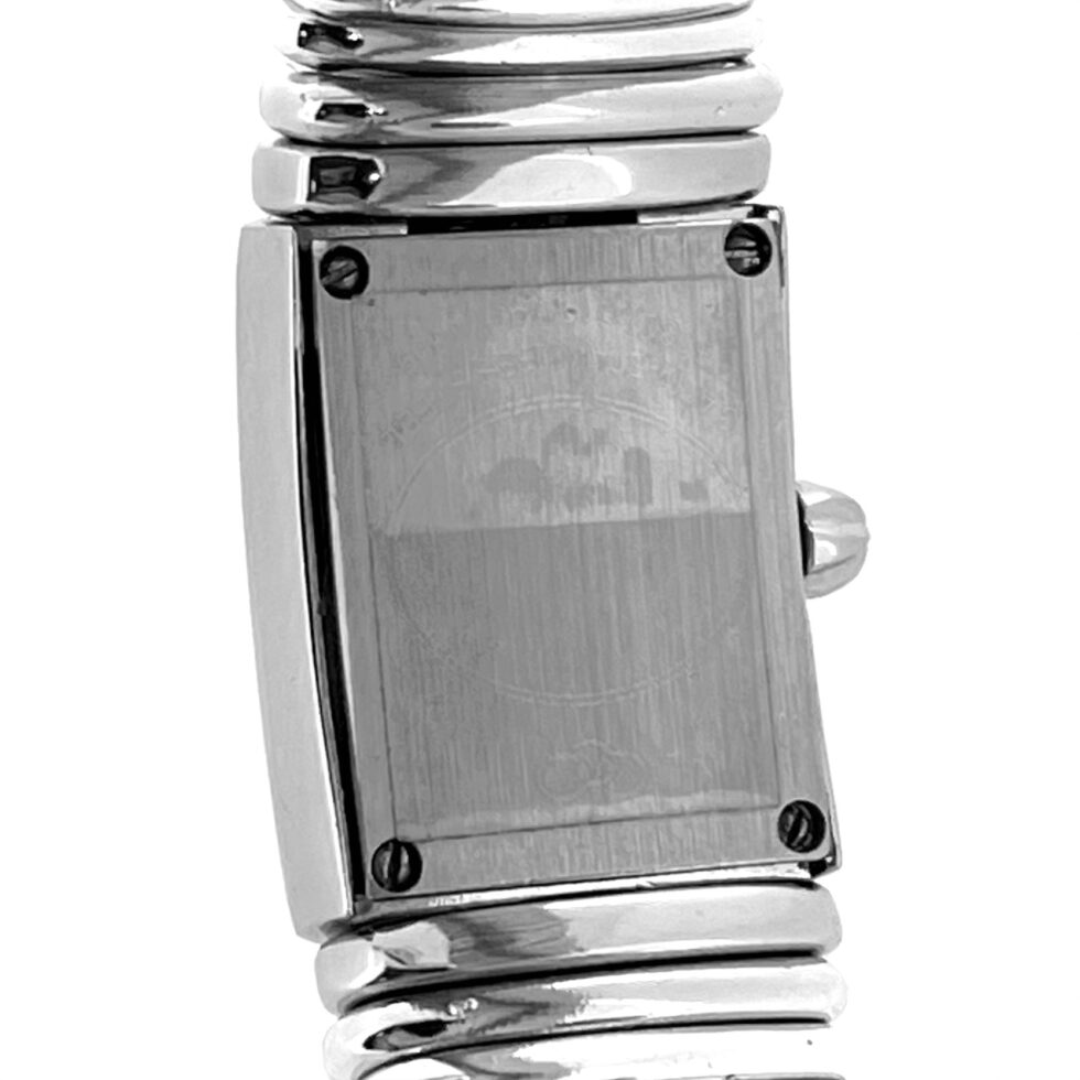 Rear angle with elastic bracelet and case screws visible.