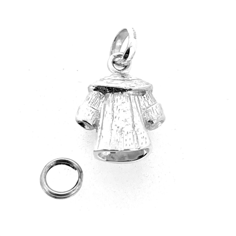 Reverse angle of vintage coat charm