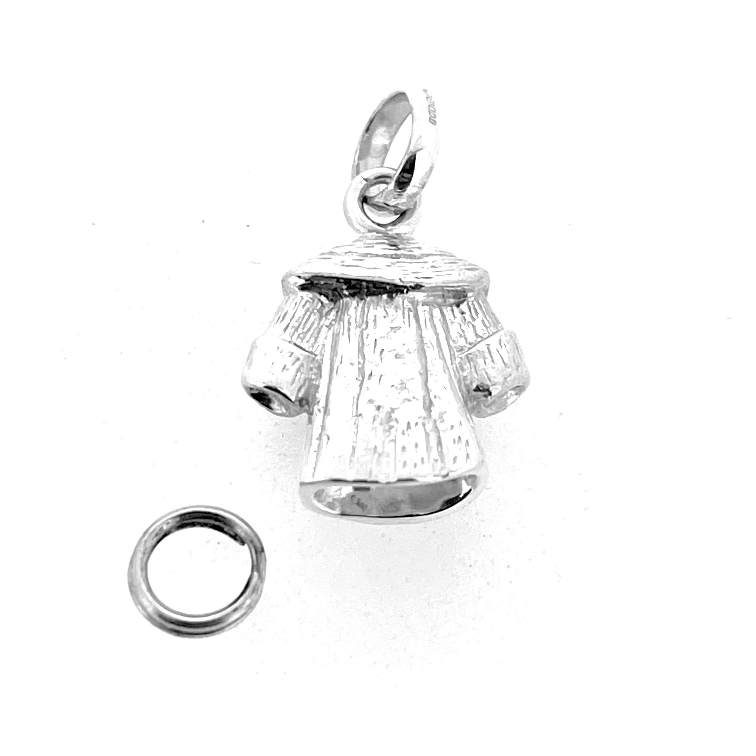 Reverse angle of vintage coat charm