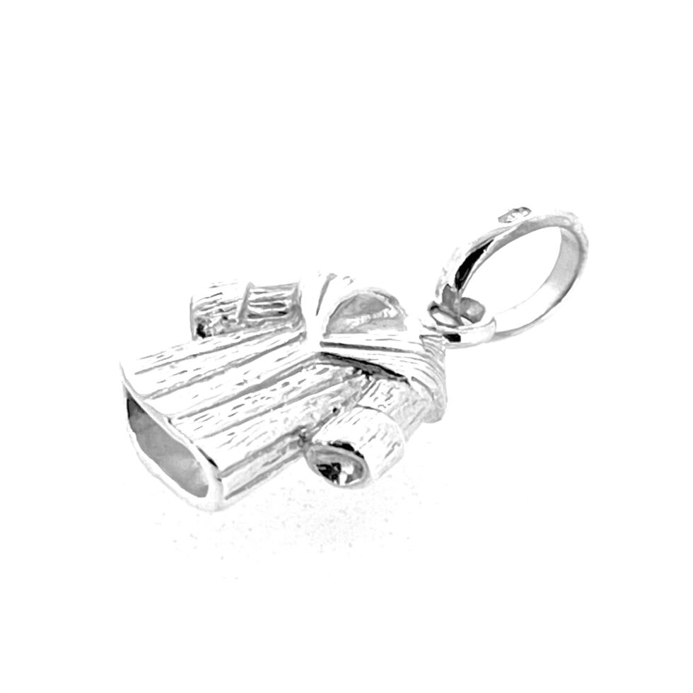 Polished sterling silver surface of coat charm