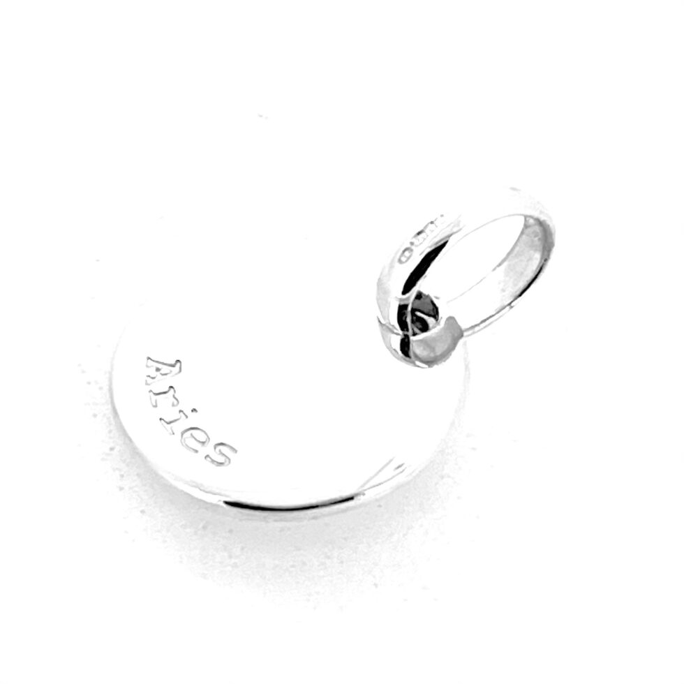 Side view showing thickness of Aries disc charm