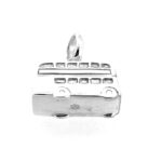 Detailed view of the charm’s wheel engravings and smooth silver finish