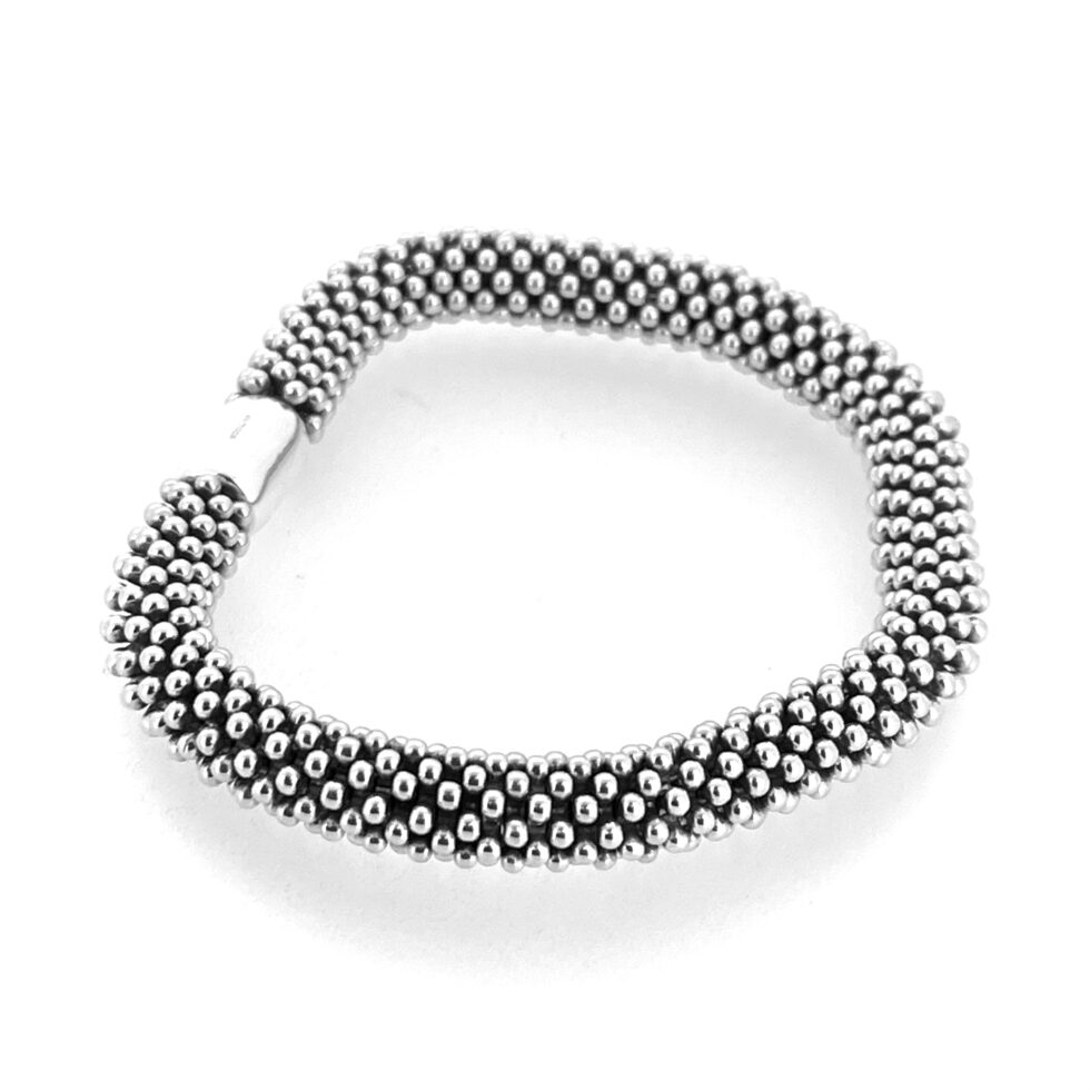 Vintage Links of London star bracelet on white background.