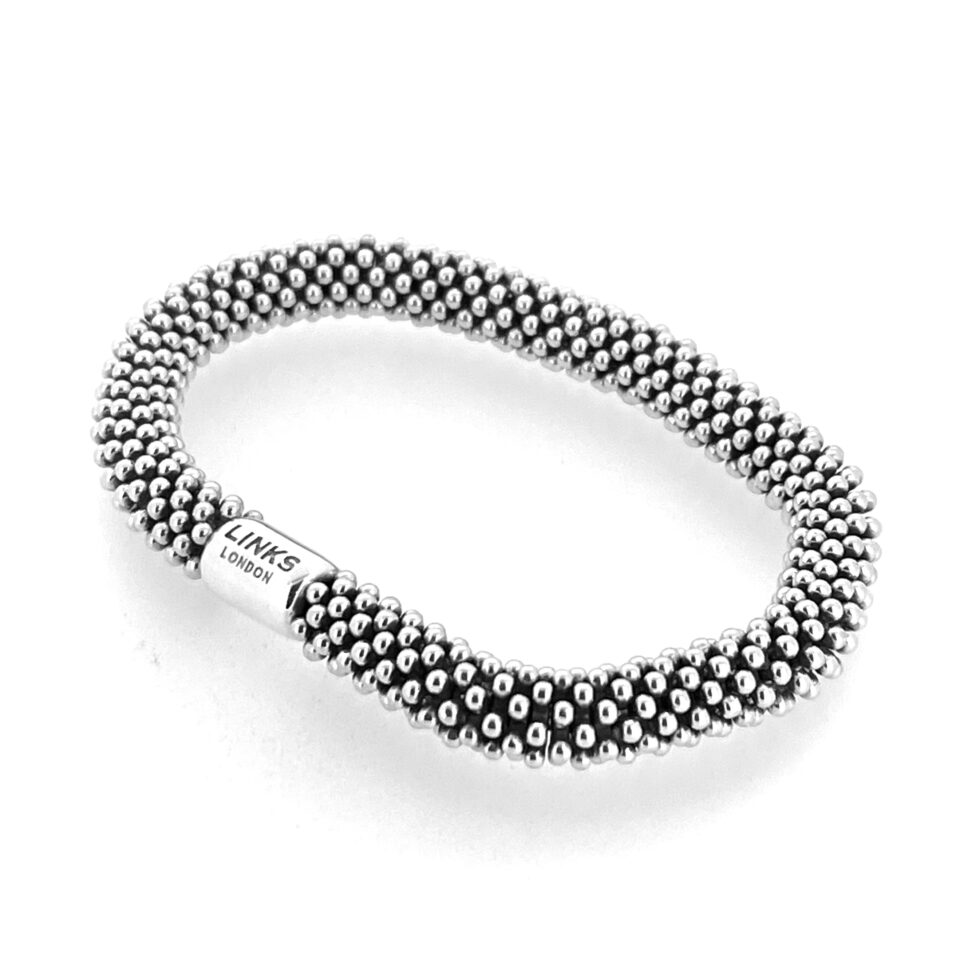 Cluster of silver star beads detail.