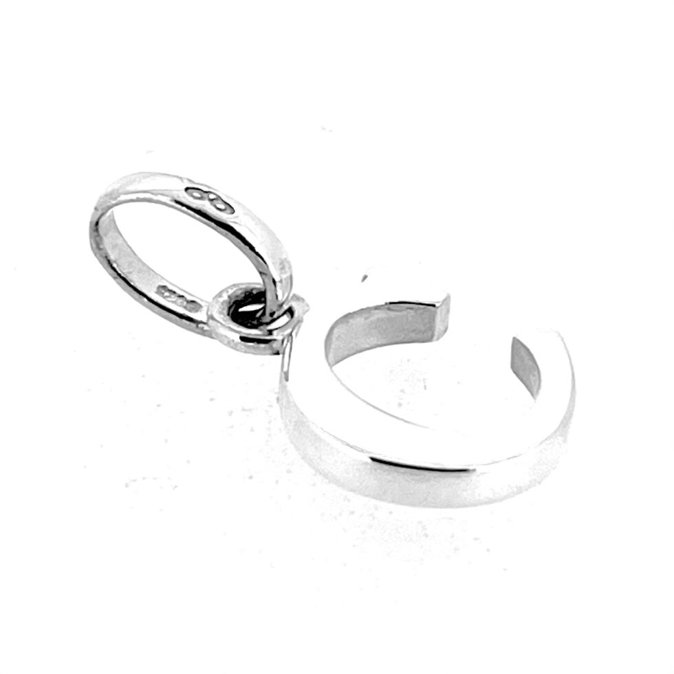 Side view of polished silver C charm