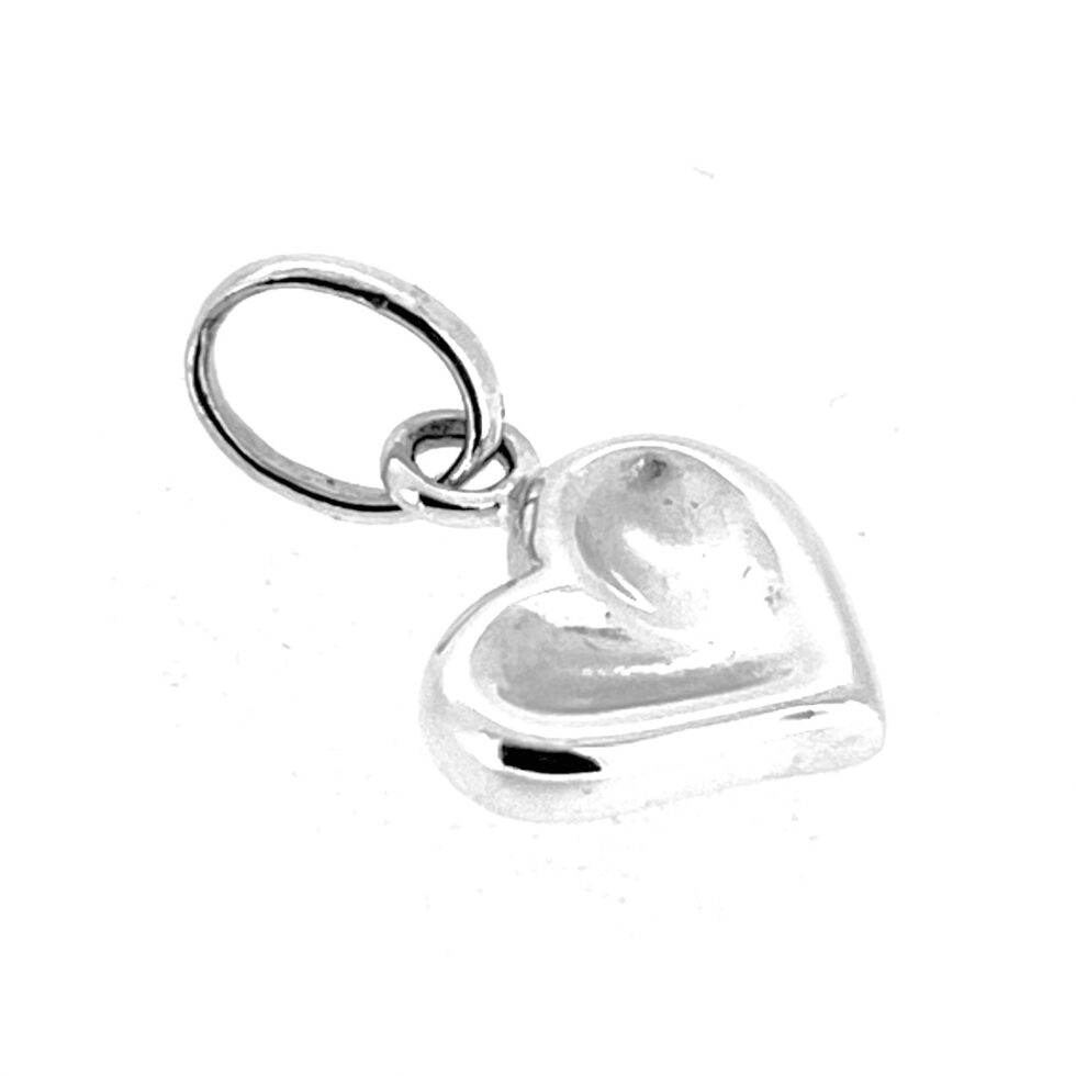 Detail view of Links of London heart charm with softened contours and depth