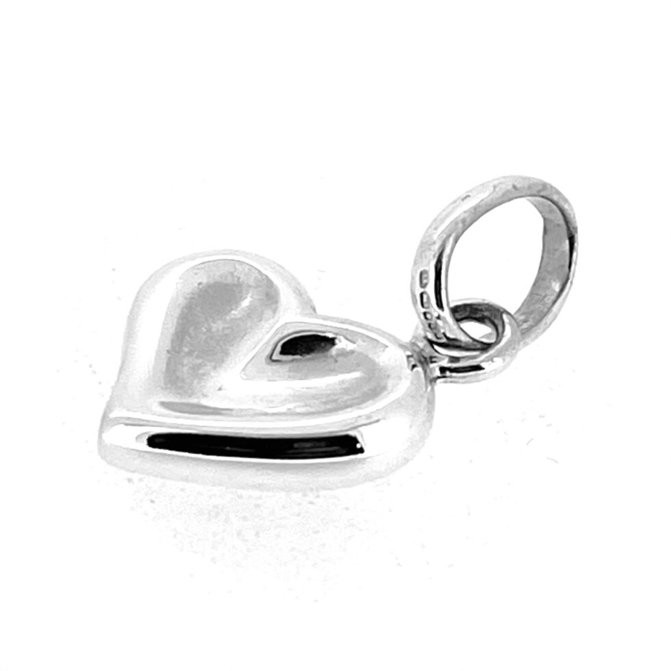 Vintage sterling silver thumbprint heart charm with three-ring logo bail