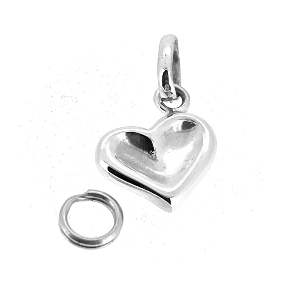 Links of London sculpted heart charm photographed from side showing angled hang