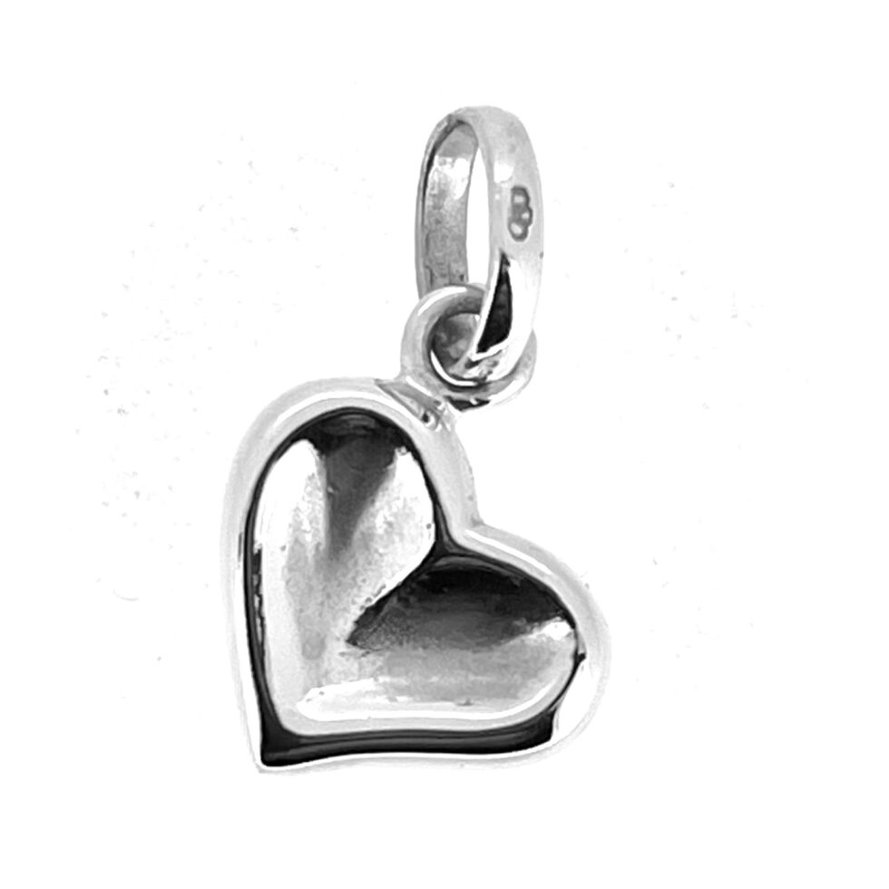 Links of London thumbprint heart charm showing soft central indentation and polished finish