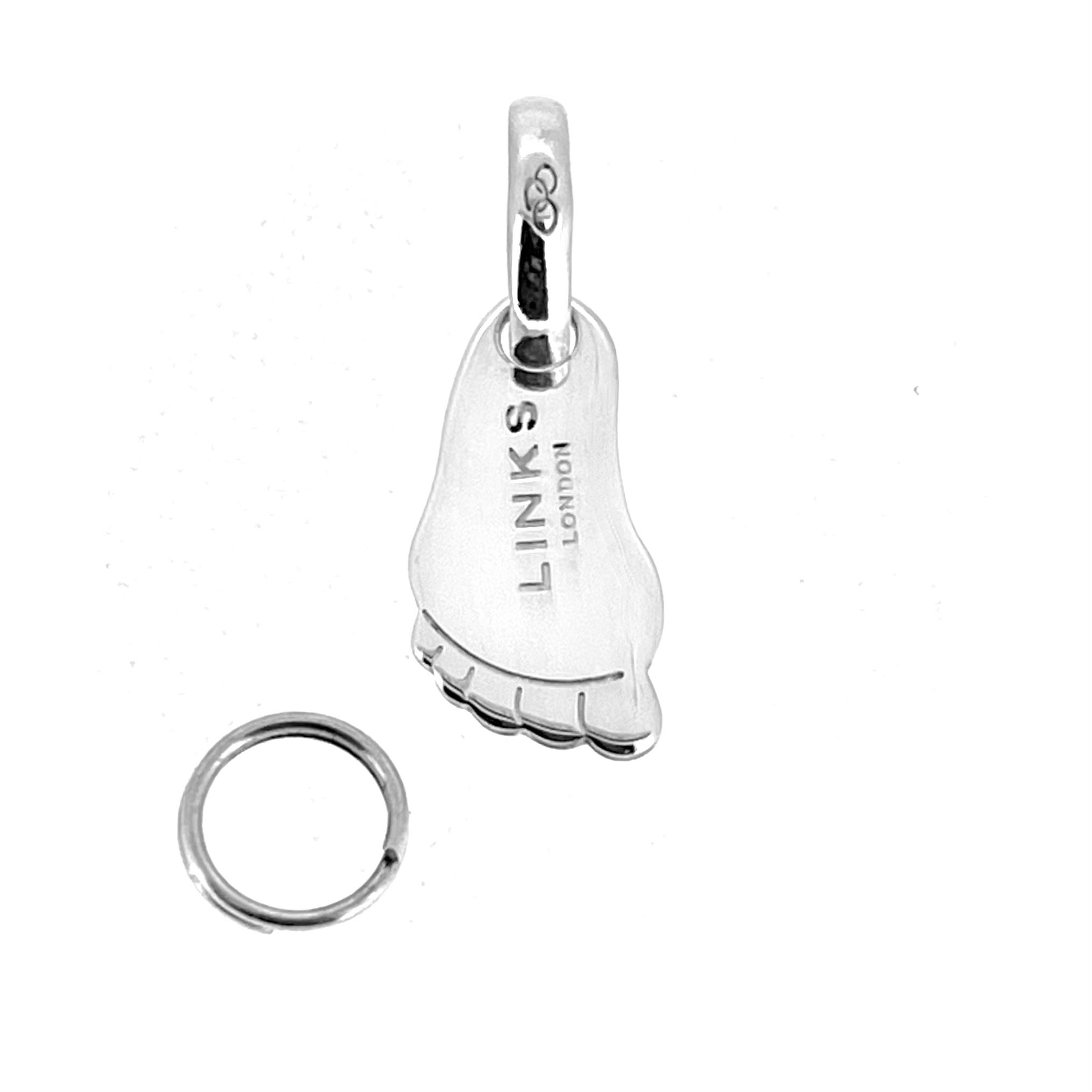 Close-up of vintage Links of London footprint charm hallmarked LL 925
