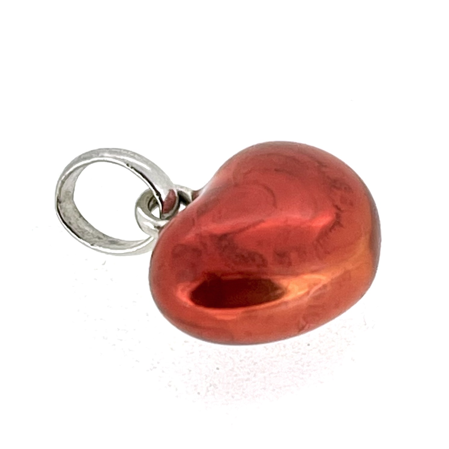 Vintage sterling silver heart charm with see-through red enamel