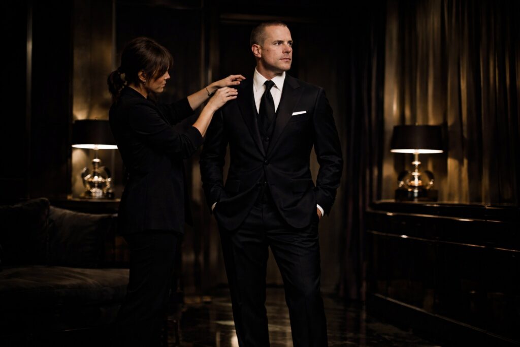 Barry Roberts being served tailoring