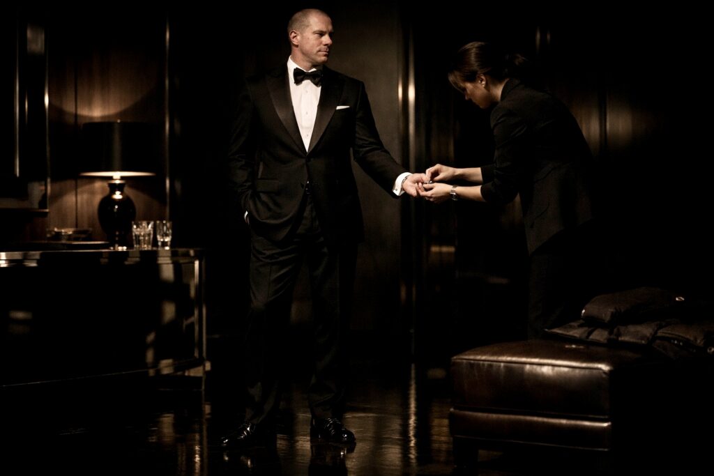 Barry Roberts being served cufflinks