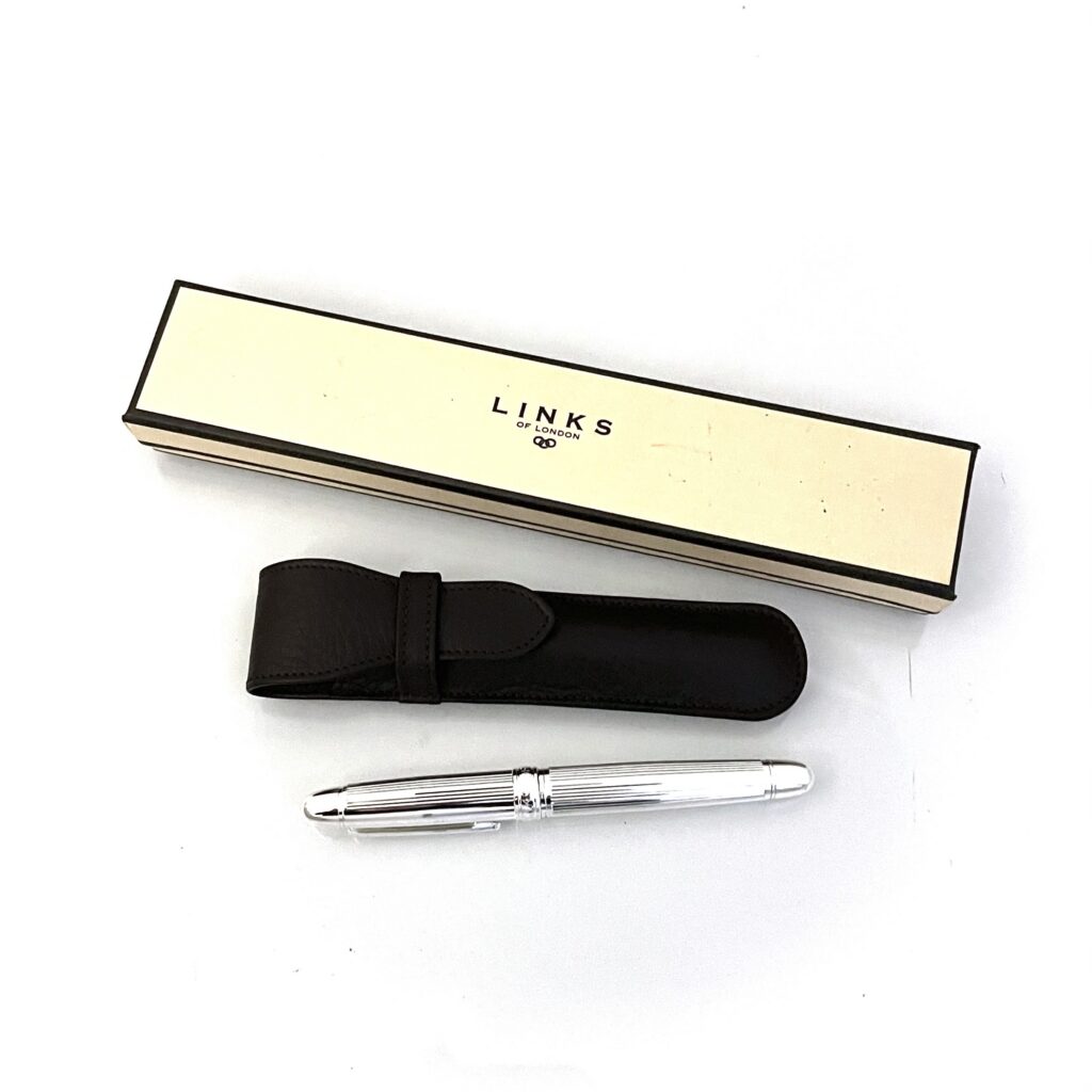 Brown leather Links of London pen case embossed logo