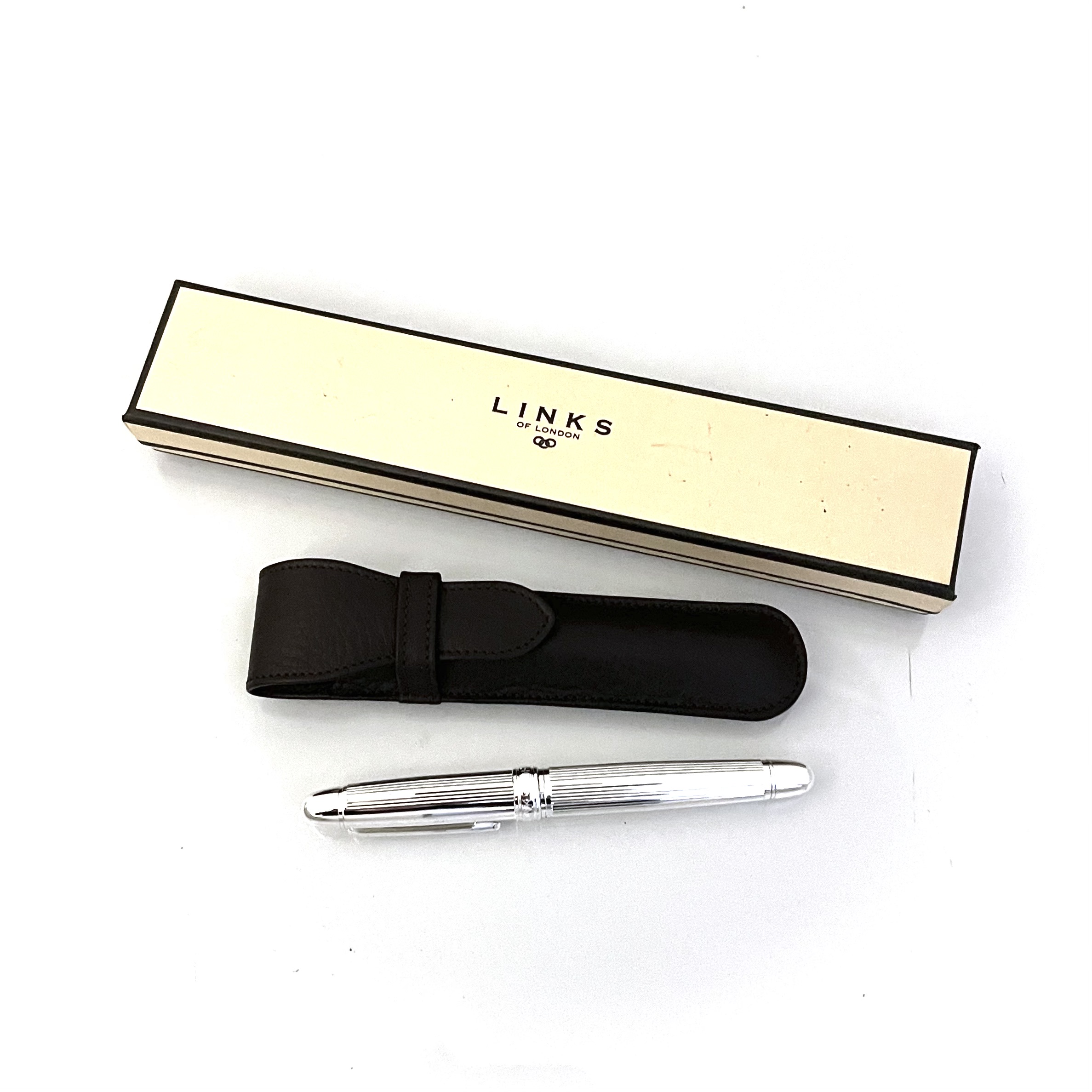Brown leather Links of London pen case embossed logo