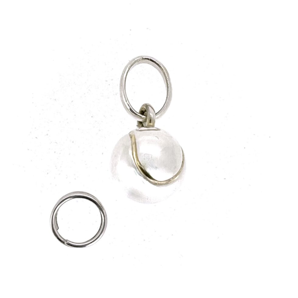 Sterling silver tennis ball charm with gold seam detail