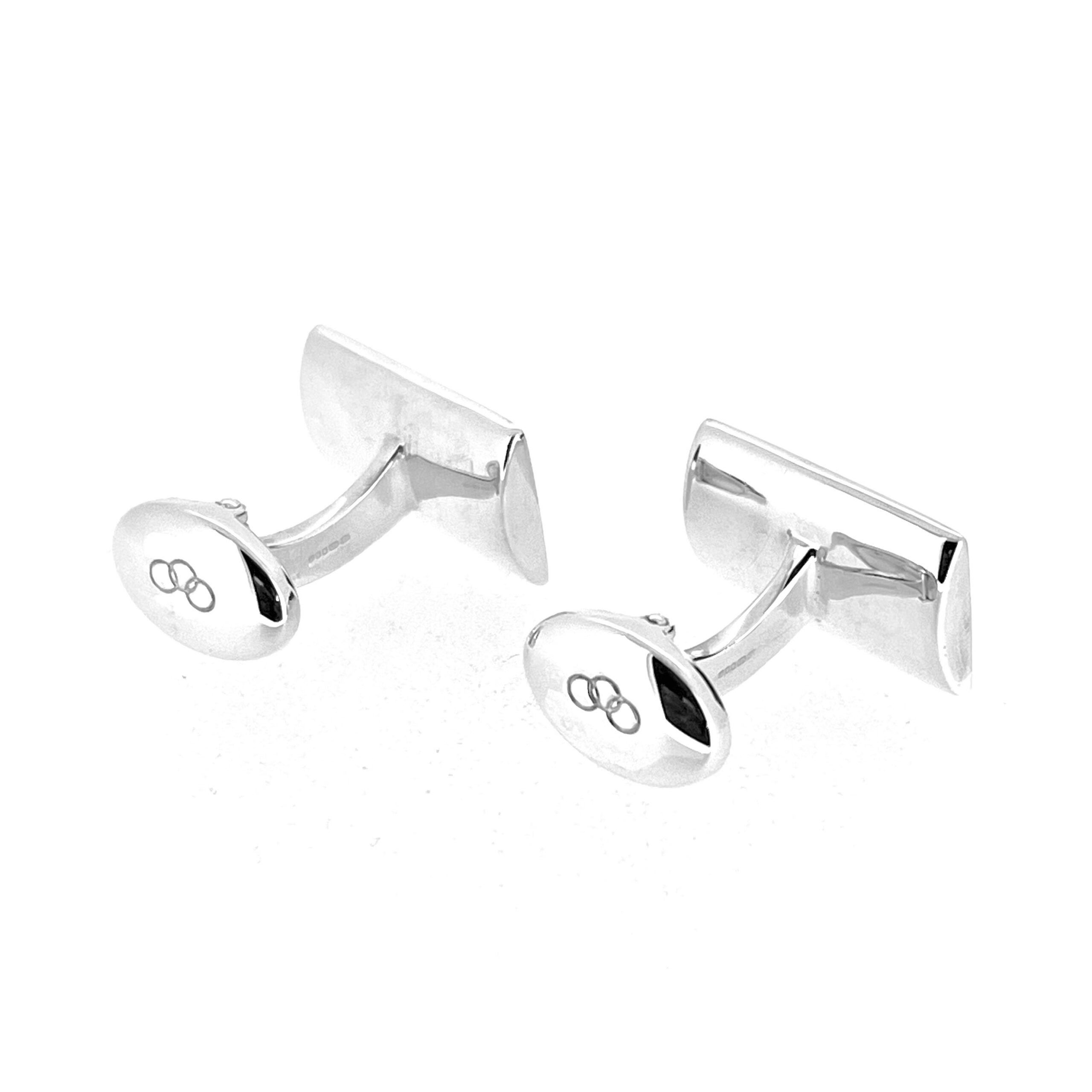 Oval back plates with three-ring logo detail