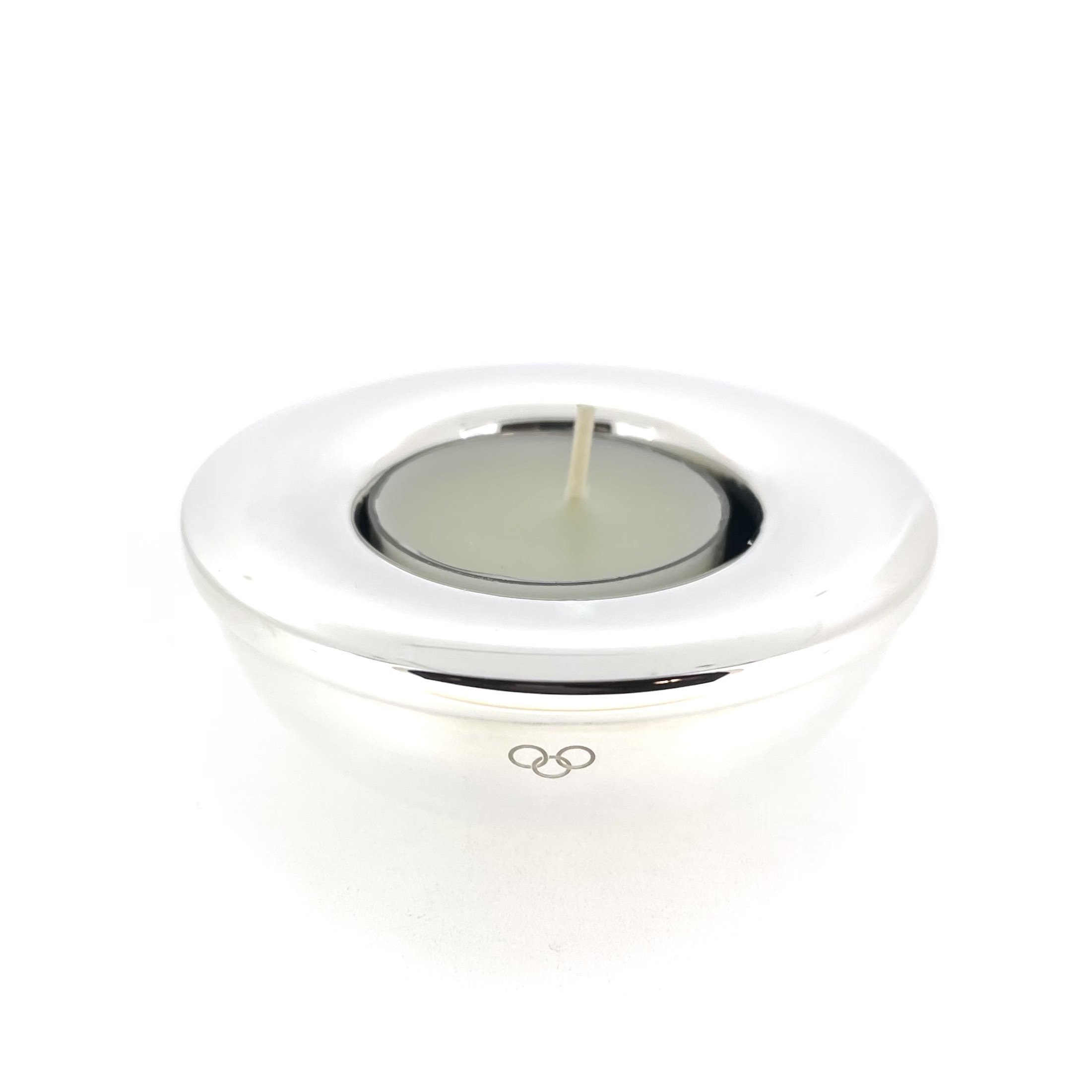 Engraved three ring logo on silver tealight holder