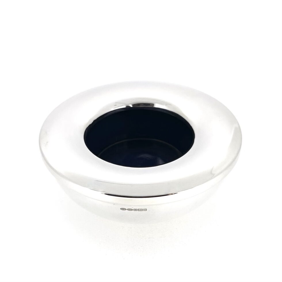 Blue glass liner inside sterling silver holder