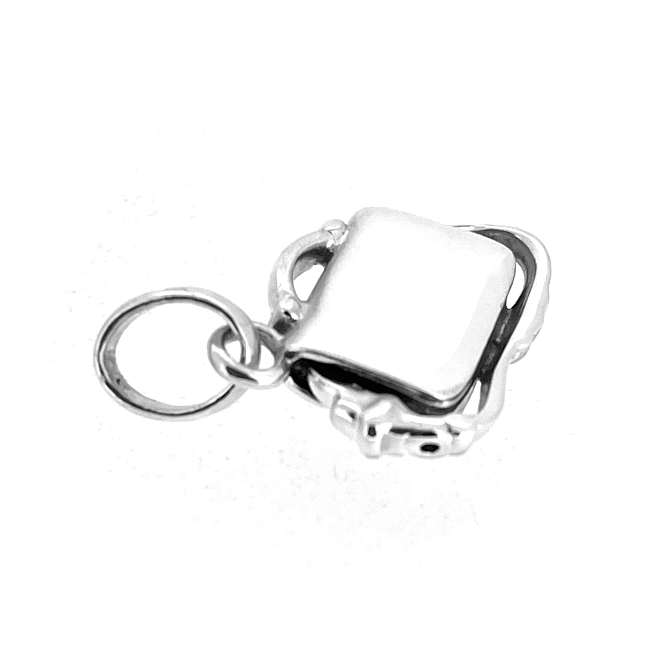 Sculptural sterling silver bag charm