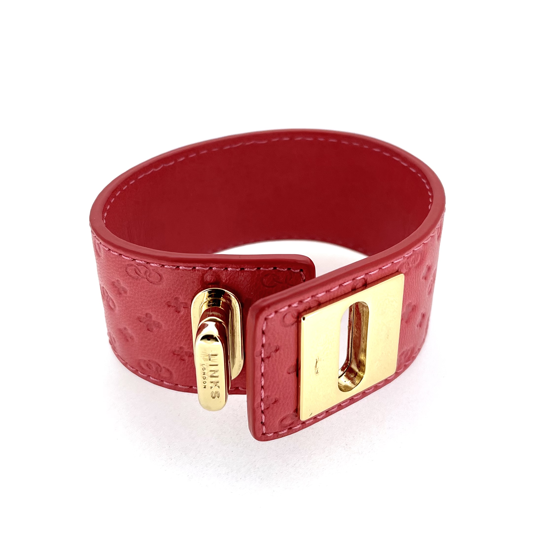 Embossed Links logo pattern leather cuff texture