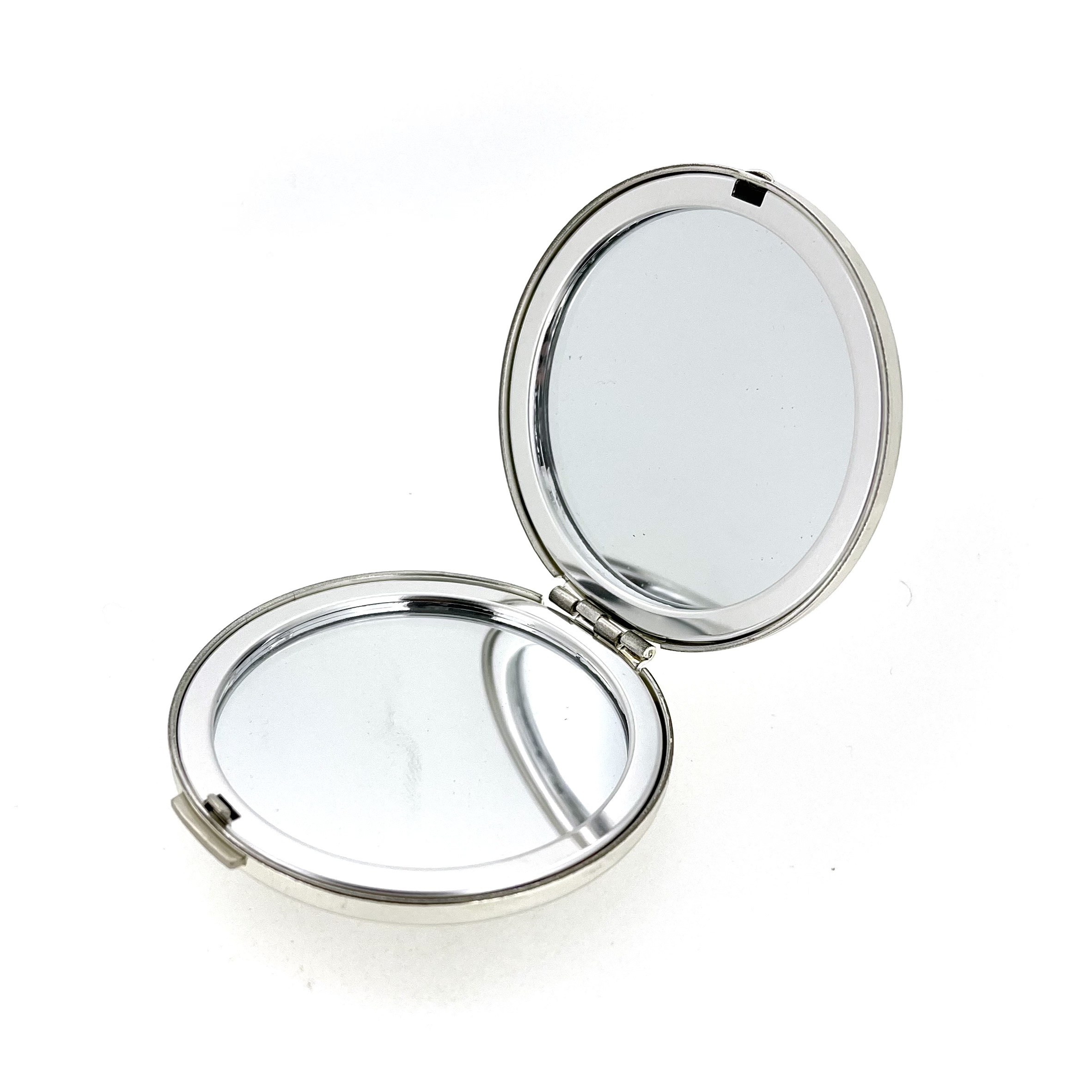 Silver plated compact mirror hinge and clasp detail