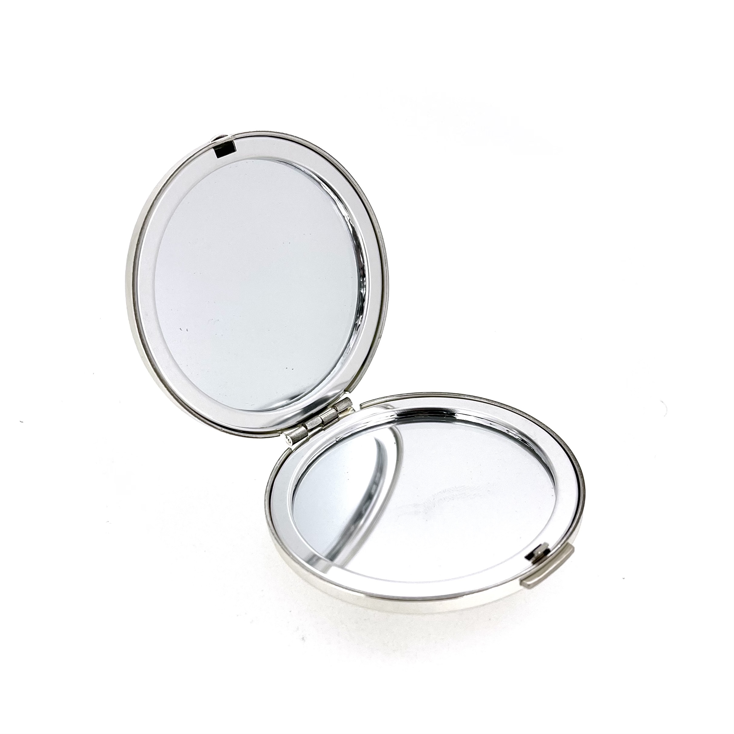 Compact mirror open showing dual mirrors interior