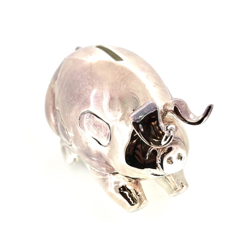 Vintage piggy bank with aged silver plating and copper tones