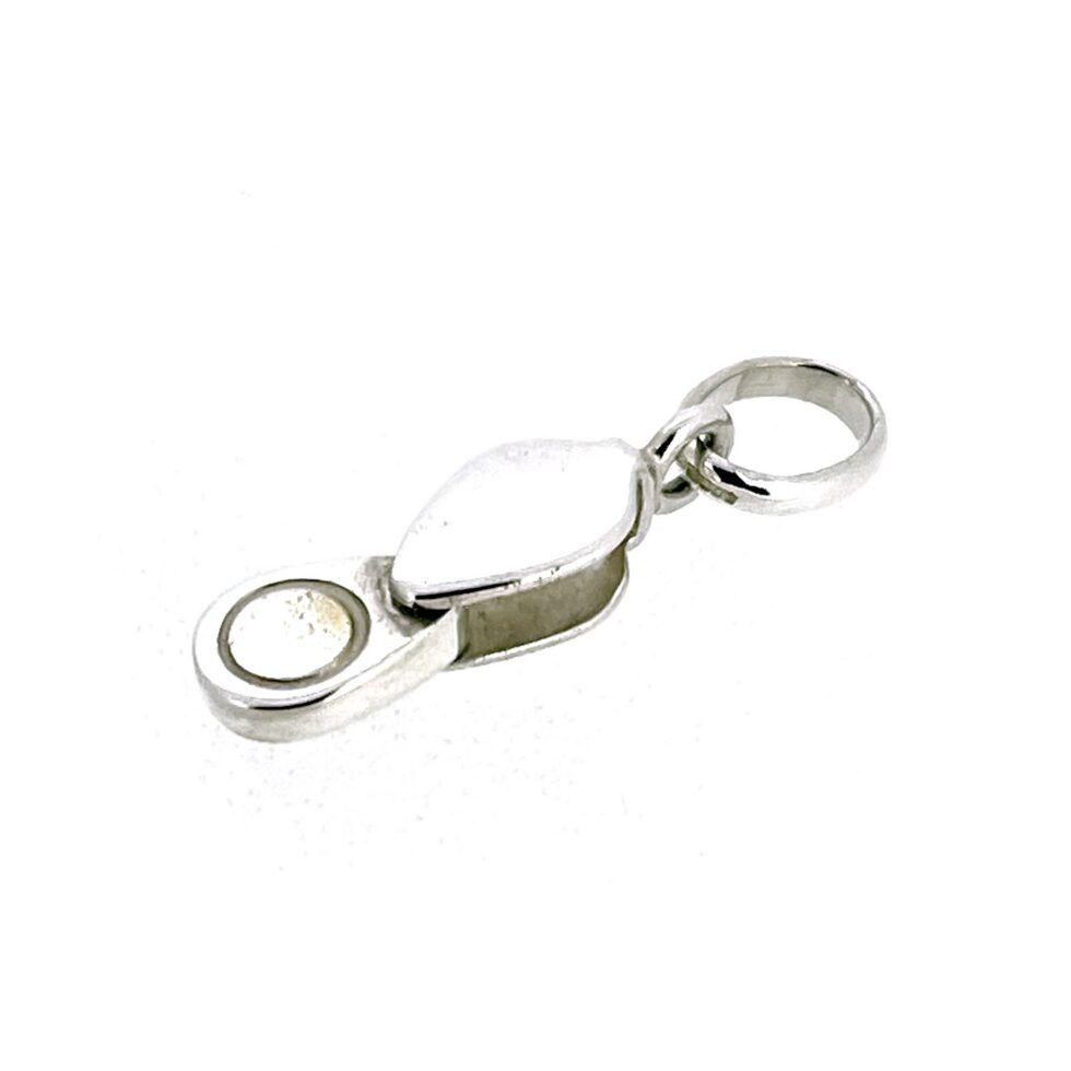 Worn vintage silver loupe charm detail