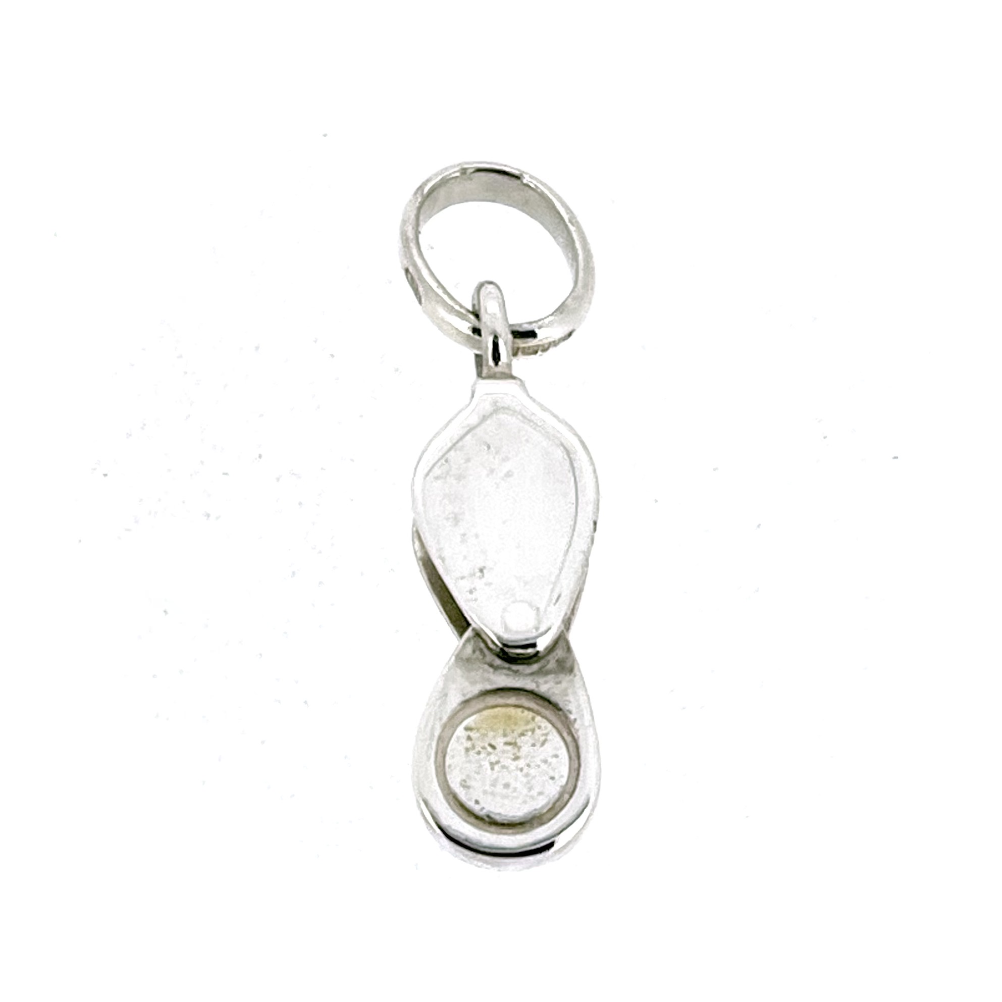 Hinged jeweller’s loupe charm in sterling silver