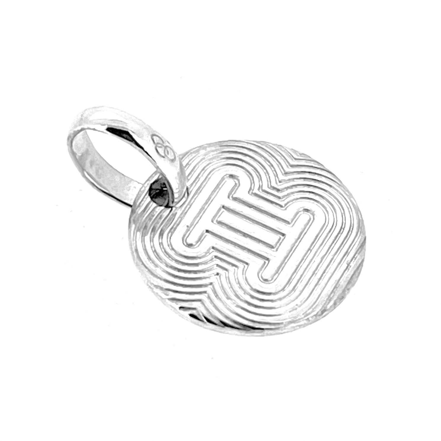 Gemini symbol engraved on silver disc