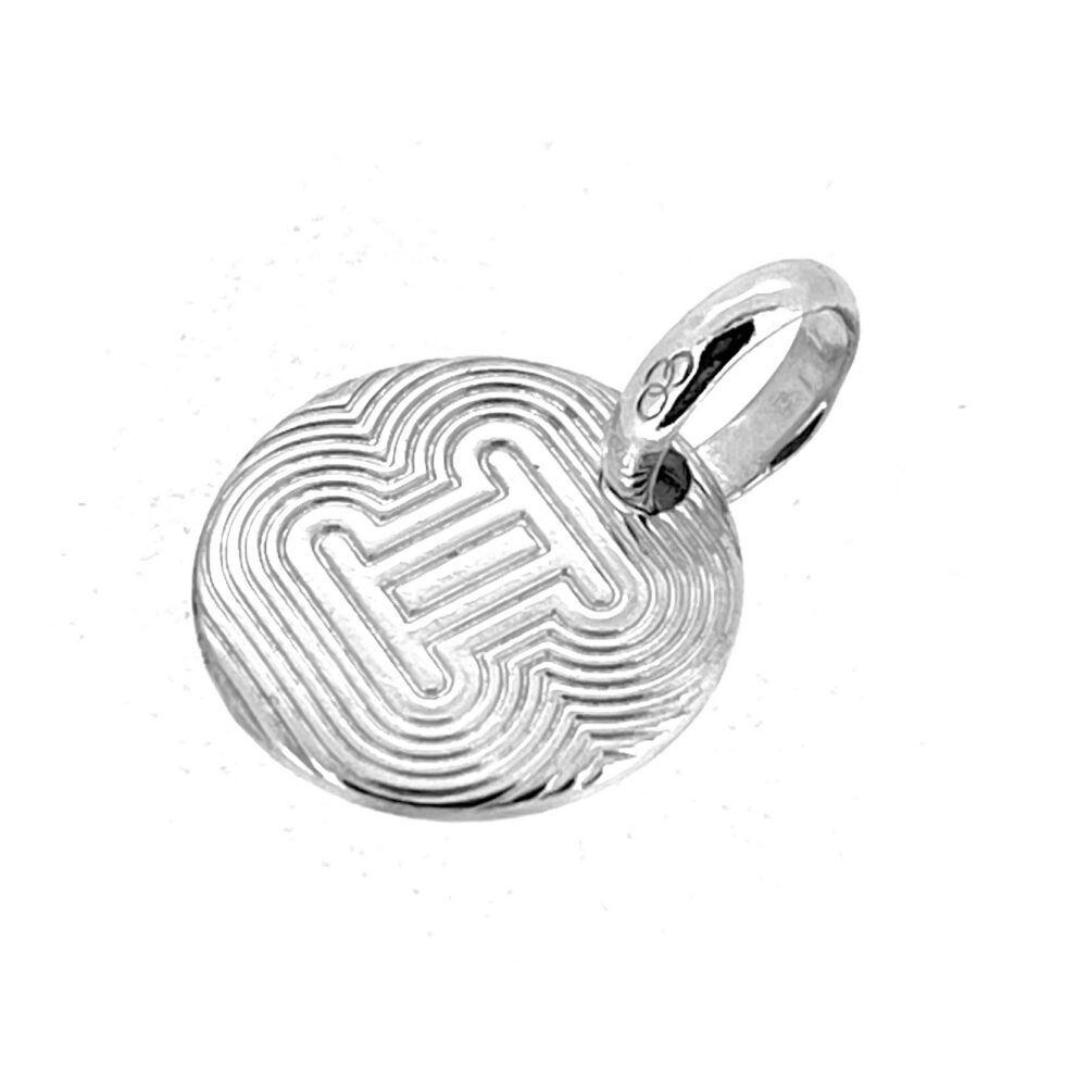 Engraved Gemini astrological glyph silver charm