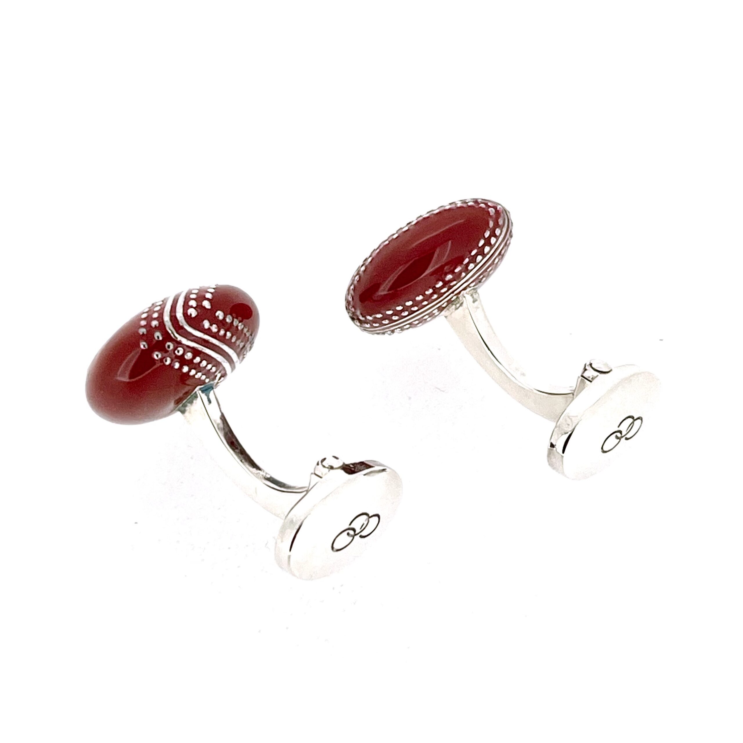 Red enamel cufflinks with three ring logo detail