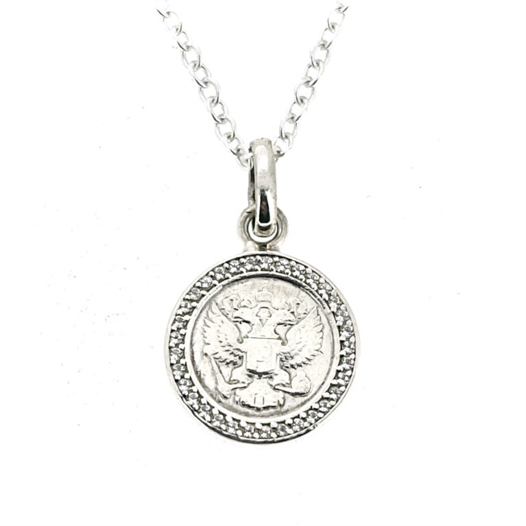Coin-style charm presented as a finished sterling silver necklace