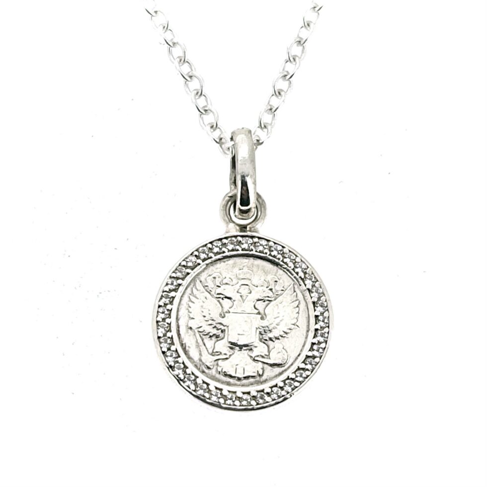 Coin-style charm presented as a finished sterling silver necklace