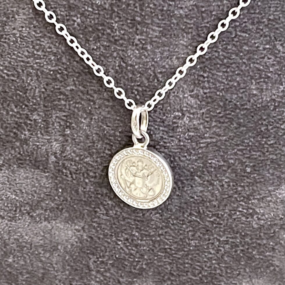 Links of London coin pendant necklace with white topaz surround