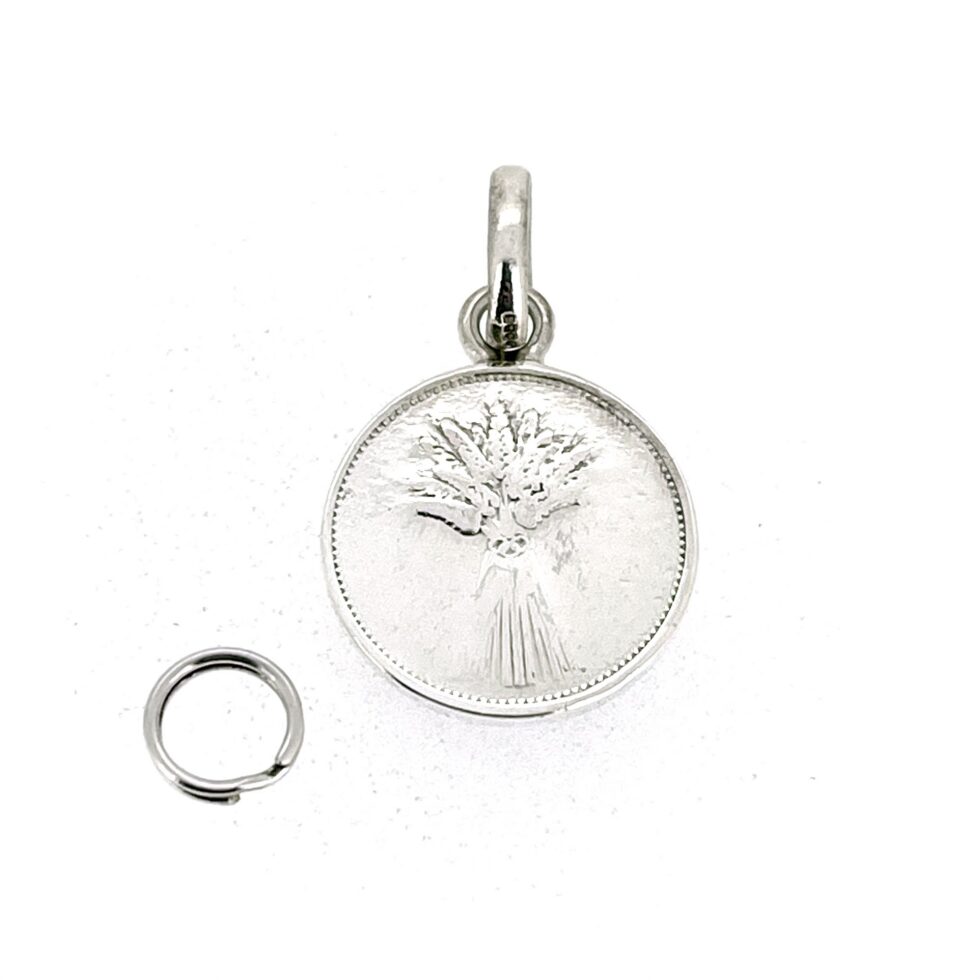 Reverse side of sterling silver coin pendant charm showing wheatsheaf design
