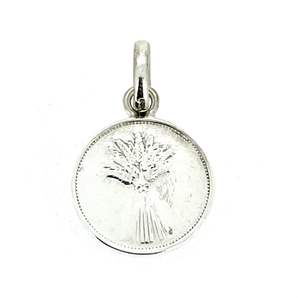 Side angle of vintage Links of London pendant charm showing coin-like thickness