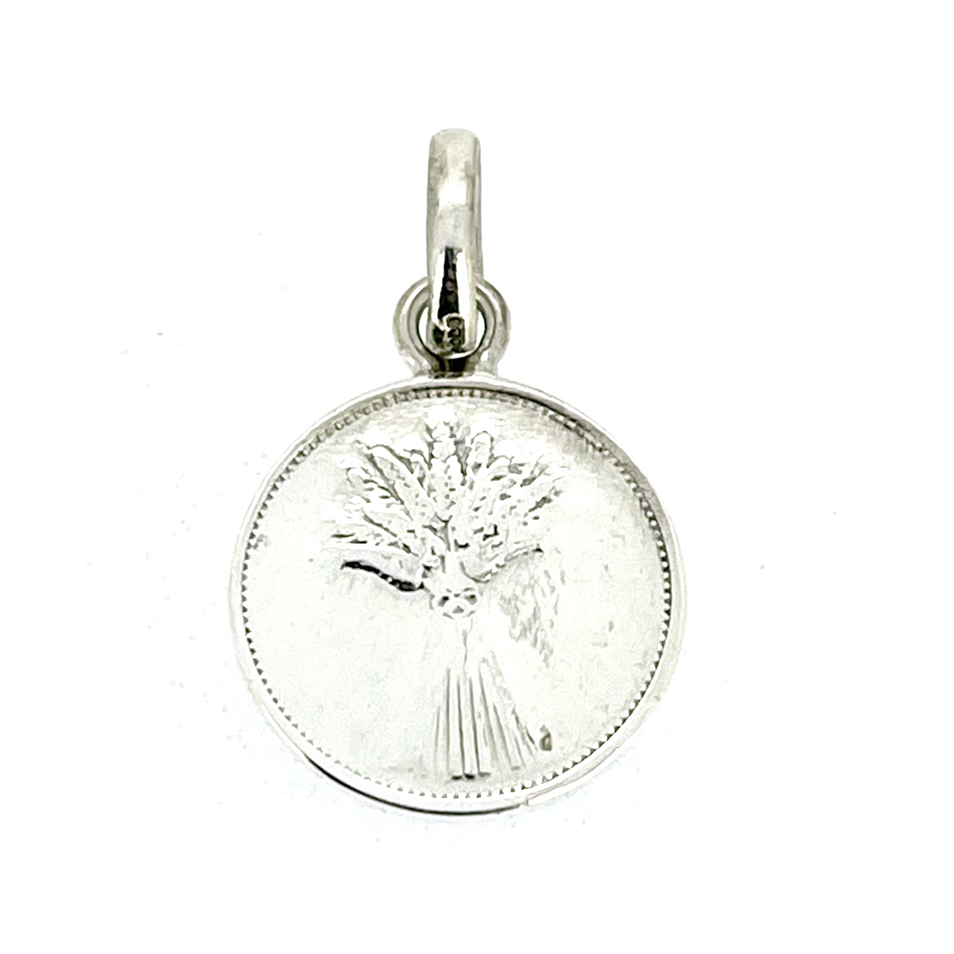 Side angle of vintage Links of London pendant charm showing coin-like thickness